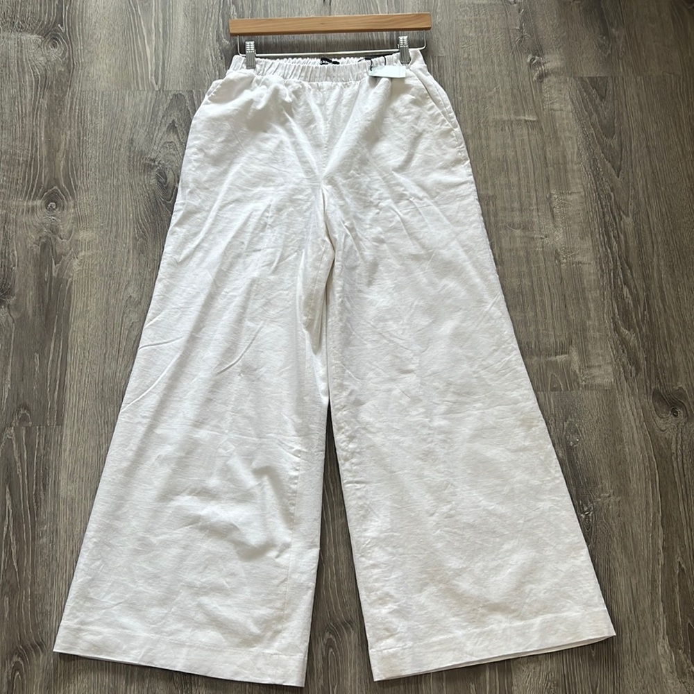 White Wide leg super high rice pants .